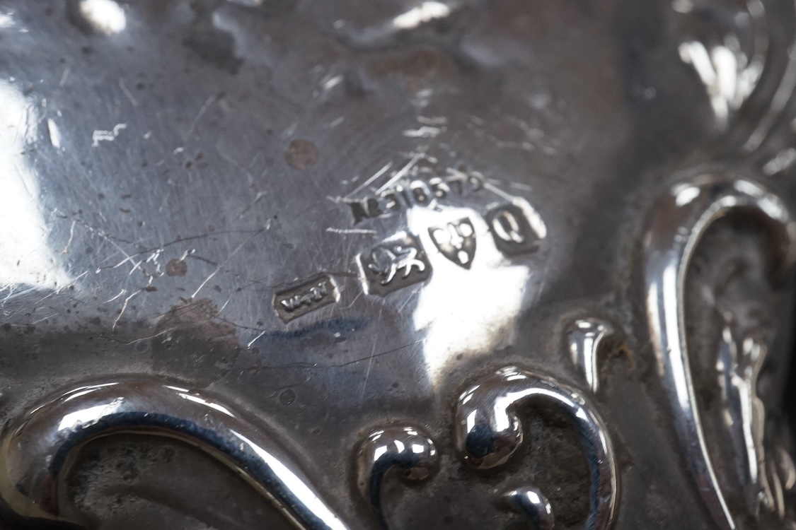 Two silver mounted hand mirrors including Reynold's Angels, Chester, 1899, 26.7cm, together with four silver mounted dressing table implements, a pair of silver mounted dwarf candlesticks and four assorted silver mounted